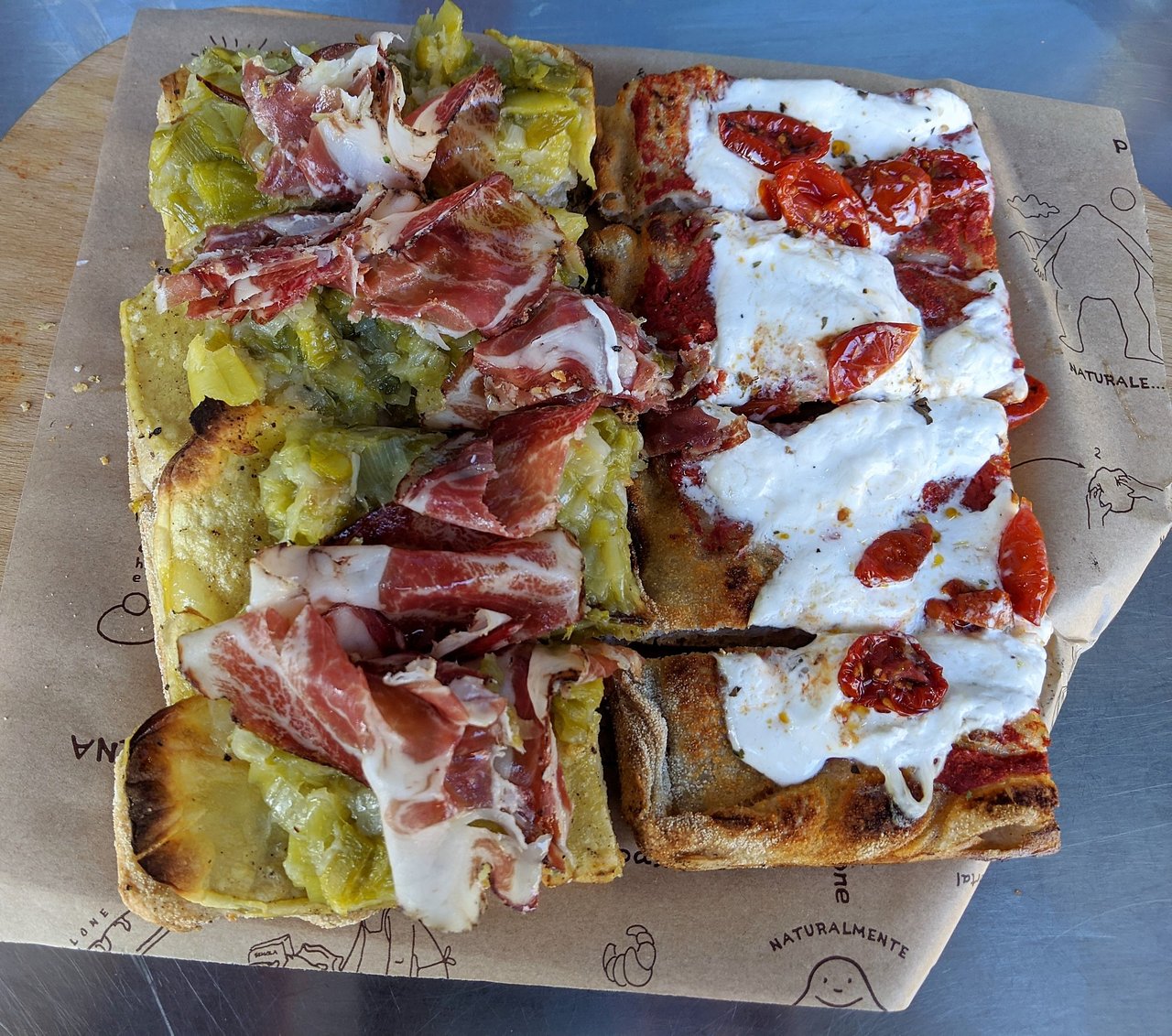 Pizzarium Bonci (IT) signature dishes Potato and Mozzarella PizzaA wide variety of seasonal toppings (e.g., Persimmon and Lardo, Artichoke and Foie Gras)Supplì (Fried Rice Balls)